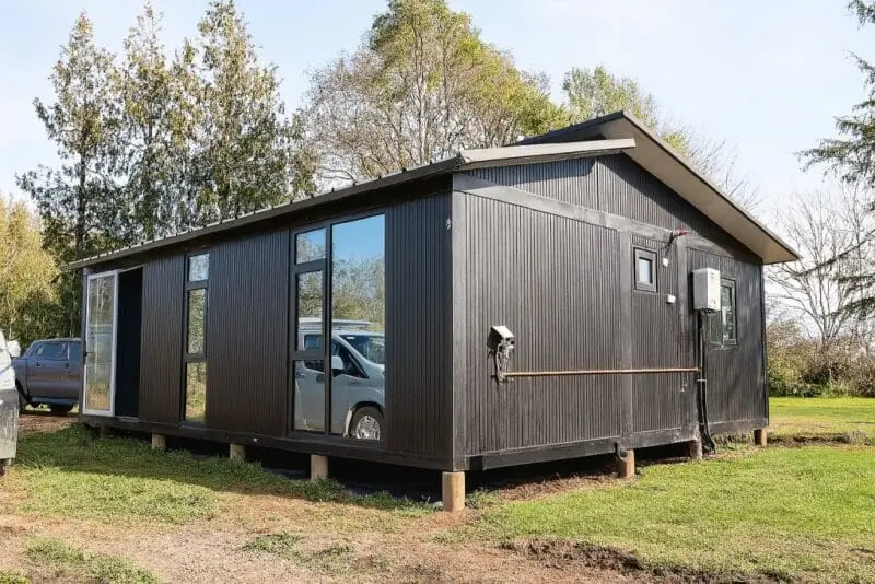 Black modern container home in New Zealand built by Portable Dwellings