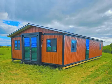 Modern tiny home in New Zealand with gable roof and double-glazed windows by Portable Dwellings
