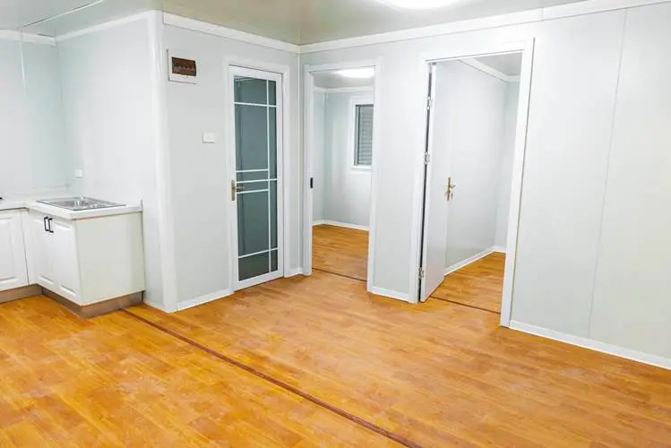 Open-plan interior of prefab and compac homes in NZ, showing flexible space ideal for container homes.