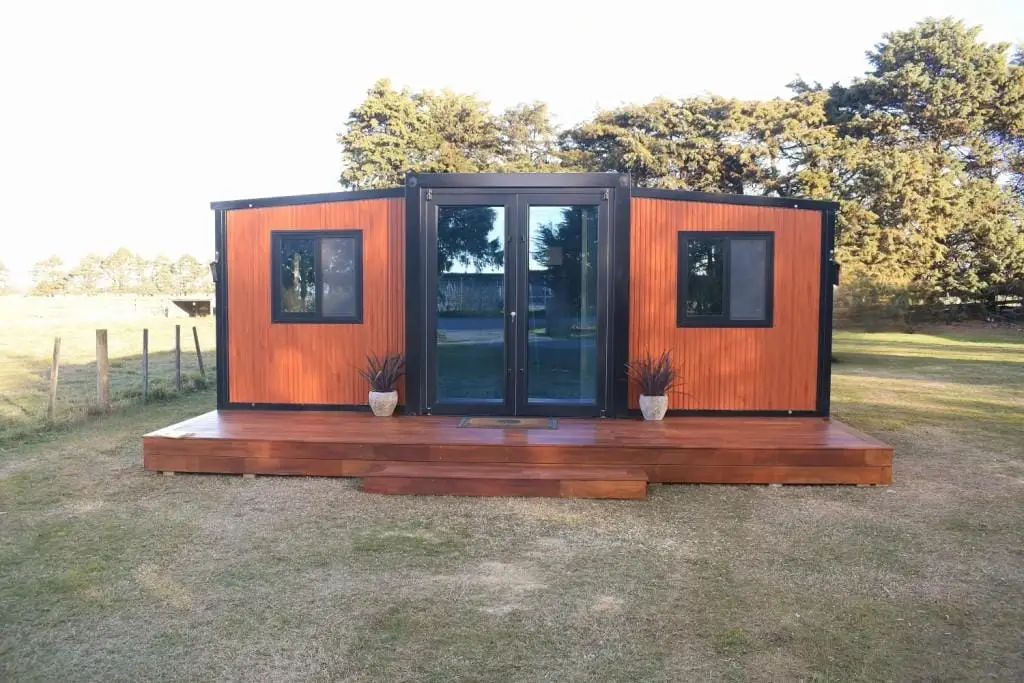 Tiny homes Christchurch – expandable tiny home with timber deck and glass doors (Portable Dwellings)