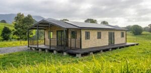 Expandable home NZ with gable roof, full deck and roof-mounted solar panels