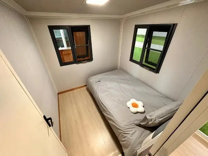 Compact and stylish bedroom interior for compac homes and tiny house NZ, perfect for affordable living.