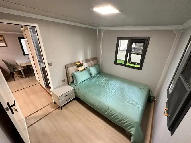 Comfortable bedroom layout inside portable cabins NZ and transportable homes, showcasing a compact and cozy design.