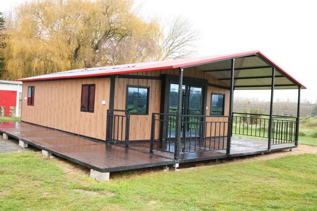 30ft expandable home in NZ with deck and gable roof